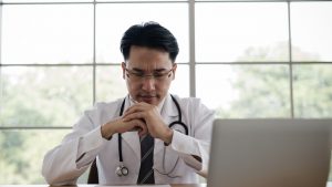 A Physician in front of a computer